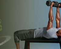 Man on a bench doing a dumbbell pullover to engage his core, blue-gray background with small alien logo; overlay headline '9 Intense Transverse Abdominis Exercises'